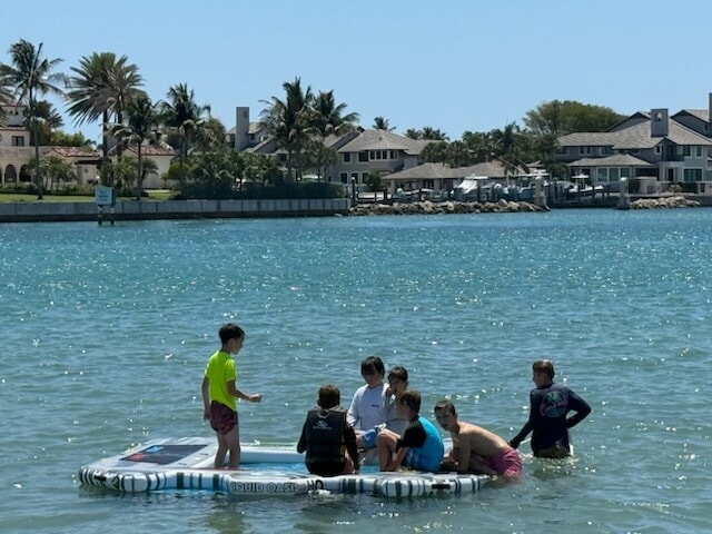 Grill cooking on a pontoon boat rental in Stuart, FL